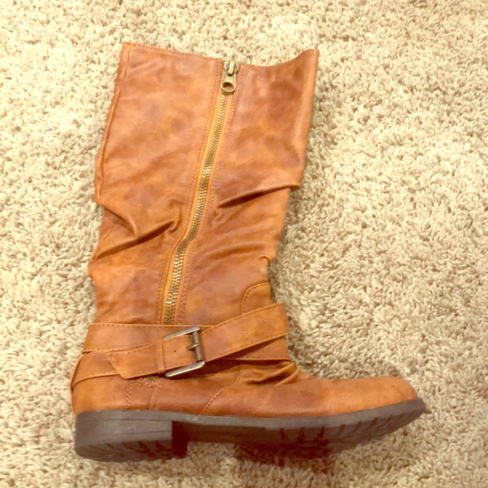 Brown tall boots.